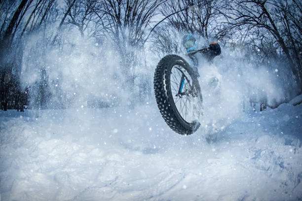 Outdoor view of many bycicles parked in the snow in the sreets of Ghent, Belgium