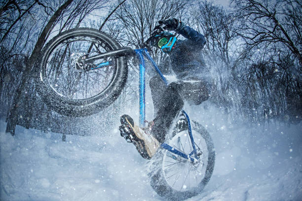 istock Man rides fat bike in the forest 642037284