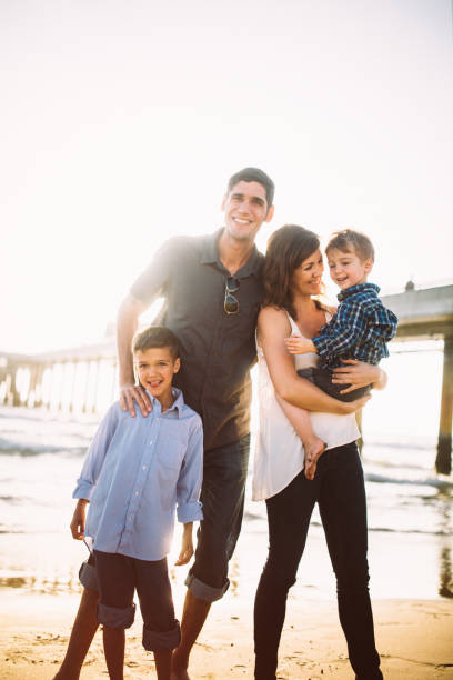 istock Millennial Family Fun At the Beach 642046416