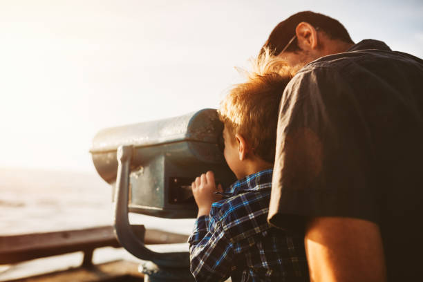 istock Father and Son Looking At Ocean View 642046442