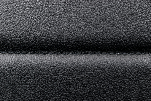 Black leather texture background with stitching
