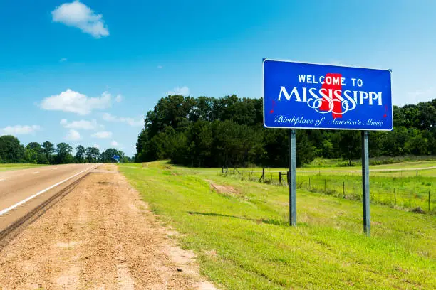 Mississippi State welcome sign along the US Highway 61 in the USA; Concept for travel in America and Road Trip in America
