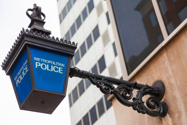 Traditional British Metropolitan Police lamp sign outside police station, London, England Traditional British Metropolitan Police lamp sign outside police station, London, England metropolitan police stock pictures, royalty-free photos & images
