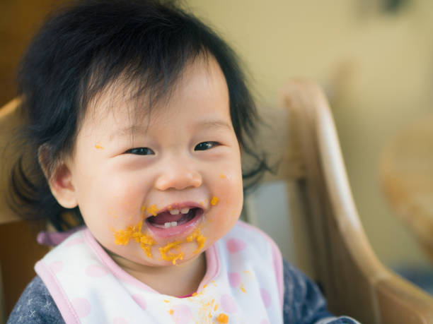 istock eating mess baby girl 642056800