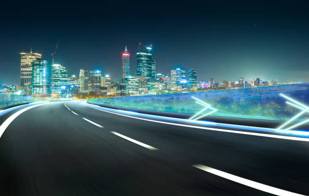 istock Blue neon light highway overpass motion blur with city  skyline background , night scene . 642068968