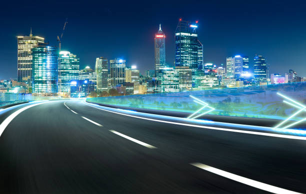 istock Blue neon light highway overpass motion blur with city  skyline background , night scene . 642068970