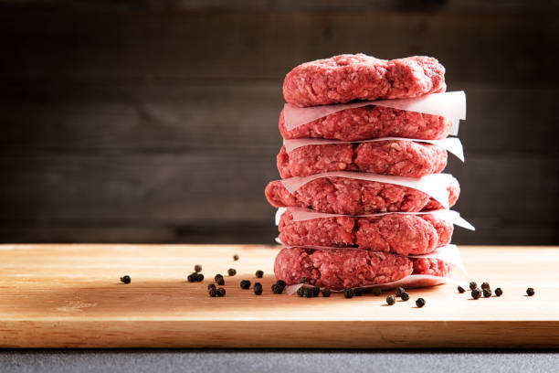 istock Stack of Six Raw Hamburgers 642069958