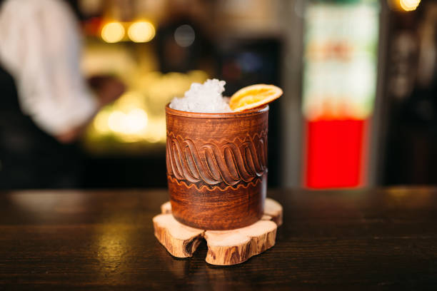 istock Alcoholic beverage in wooden cup closeup 642071380