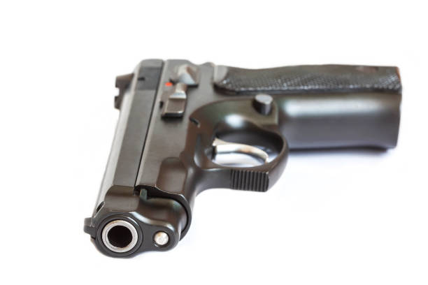 istock close up automatic pistol handgun isolated on white background 642071408