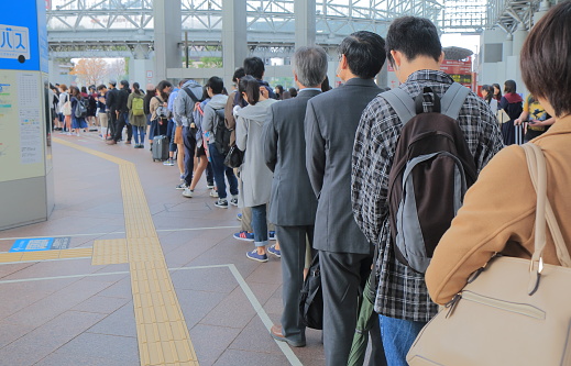 Kanazawa Japan - October 18, 2016: Unidentified people queue at Kanazawa station bus terminal.