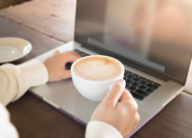 istock Woman working with laptop and hot coffee 642072642