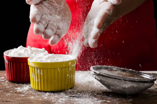 istock Sifting wheat flour into a bowl 642080438
