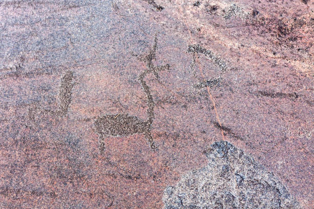 istock Ancient petroglyphs on granite Onega Lake shore 642080526