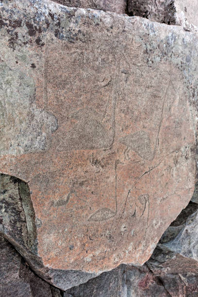 istock Ancient petroglyphs on granite Onega Lake shore 642083120