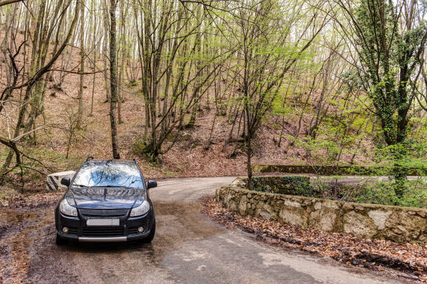 car on a mountain road stock photo