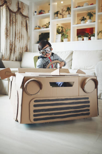 istock Children play in the cardboard car 642100128