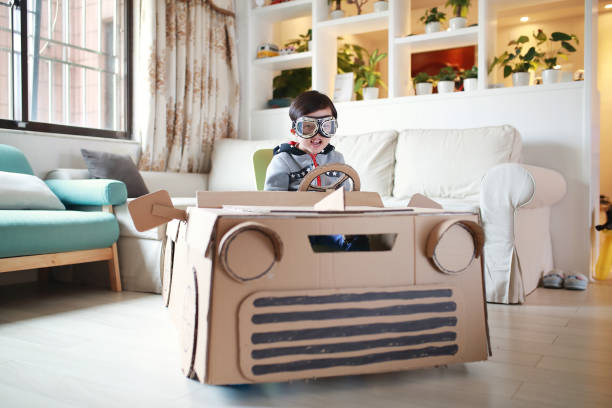 istock Children play in the cardboard car 642100150