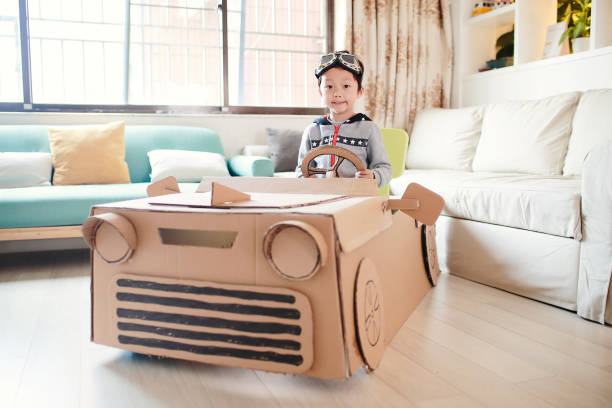 istock Children play in the cardboard car 642100252