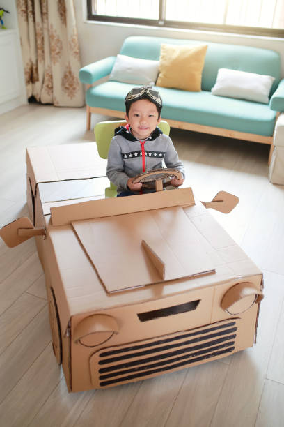 istock Children play in the cardboard car 642100778