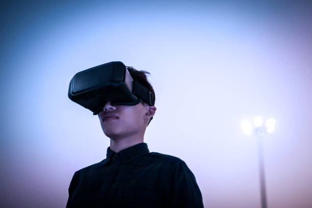 istock Man wearing virtual reality simulator outdoors 642110690