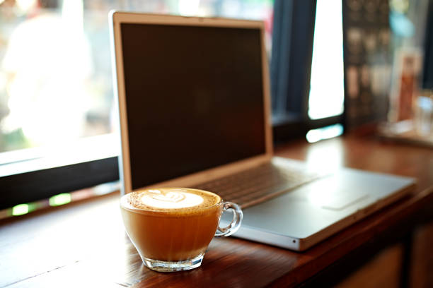 istock laptop with fresh cup of coffee 642113846