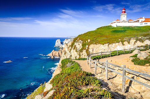 Cabo da Roca, Portugal. Lighthouse and cliffs over Atlantic Ocean, the most westerly point of the European mainland.