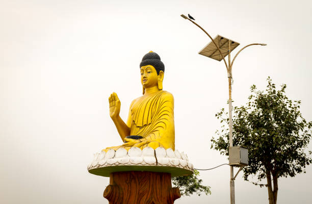 Golden Statue of Buddha with his blessing hand.