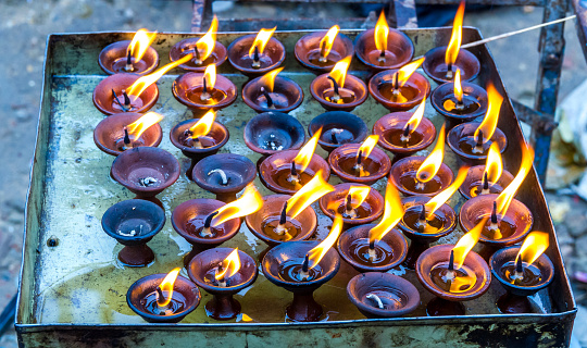 Butter Lamps burning at the religious place Swayambhunath in Nepal.