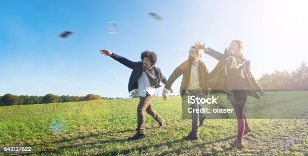 Getting Rid Of Their Phones By Throwing Them Away Stock Photo - Download Image Now - Throwing, Telephone, Mobile Phone