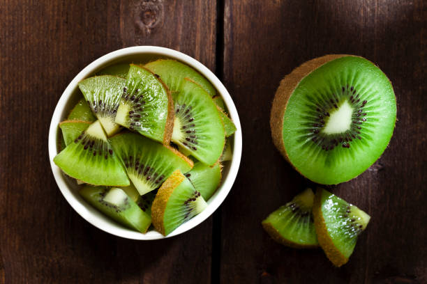 istock Round white bowl filled with kiwi slices 642136884
