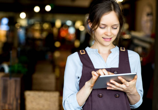 istock Closeup of Content Nice Woman Networking on Tablet 642143094