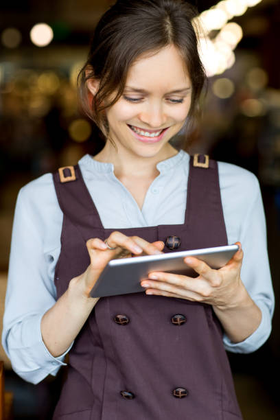istock Closeup of Smiling Nice Woman Networking on Tablet 642143138