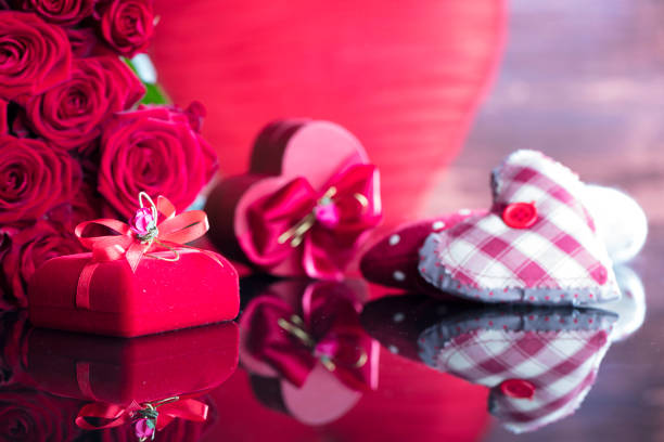 Roses and gifts on glass table