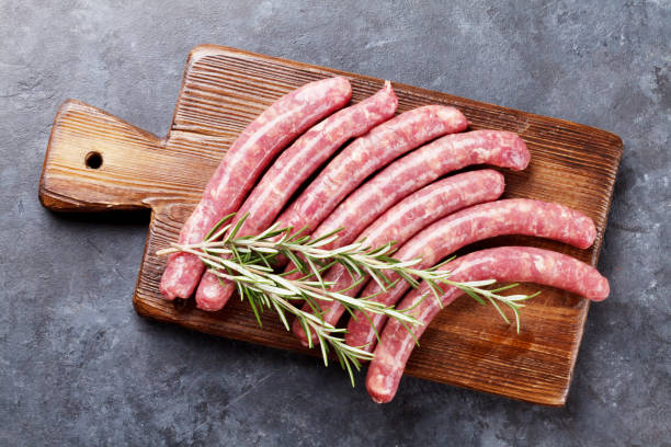 istock Raw sausages and ingredients for cooking 642172224