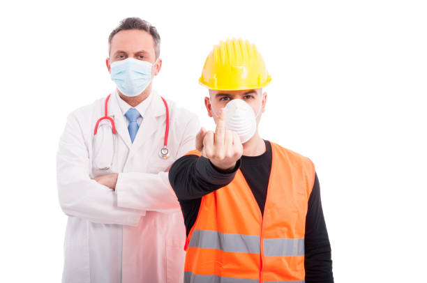 istock Angry doctor and constructor showing obscene gesture 642173650