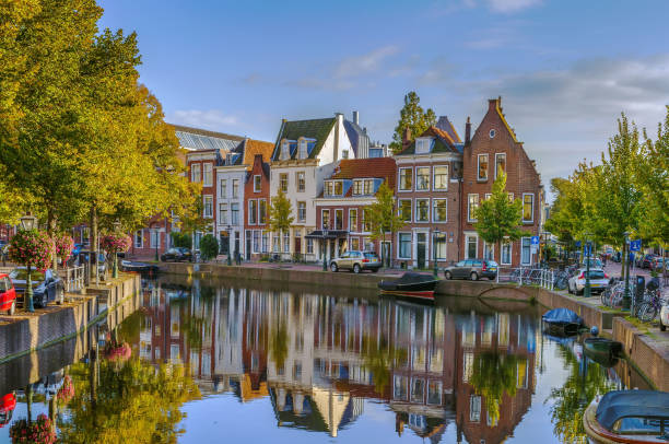 Cityscape of Leiden, Netherlands Cityscape of Leiden with channel in city center, Netherlands canal house photos stock pictures, royalty-free photos & images