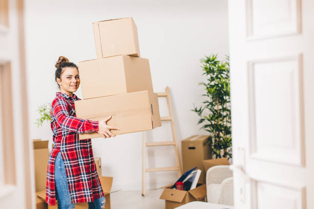 istock New beginings, woman unpacking at home 642174154