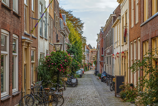 Street with historical houses in Leiden downtown, Netherlands