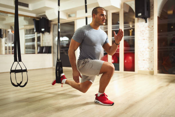 istock TRX suspension training- man doing leg exercises 642174286