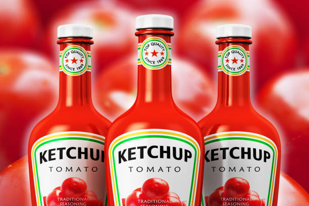 istock Group of plastic ketchup bottles against tomato background 642182320