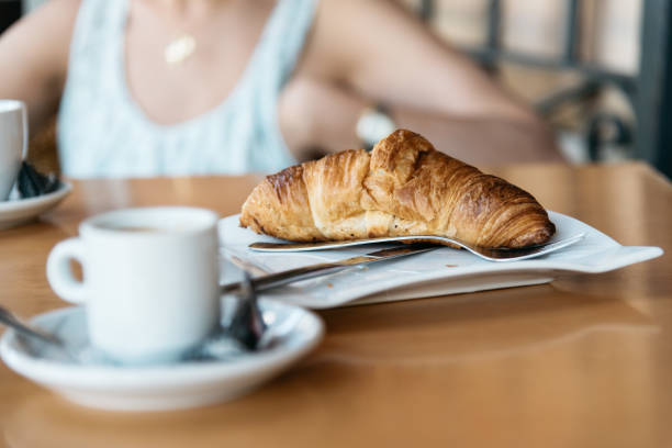 istock Coffee, croissant and woman on background 642182548
