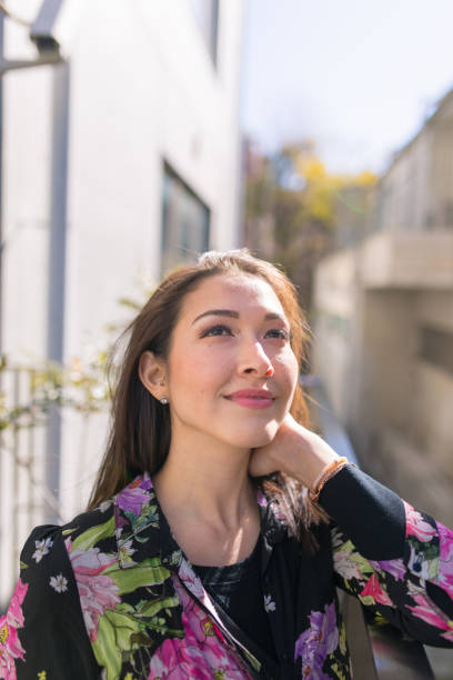 istock Happy young woman looking at the sky 642182722