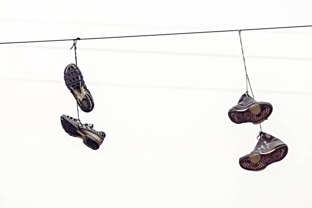 istock two couples fragmentary sneakers on wires 642194958