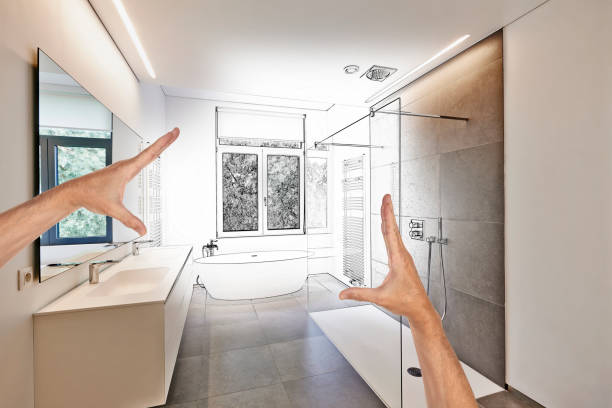 Planned renovation of a Luxury modern bathroom Planned renovation of a Luxury modern bathroom, Bathtub in corian, Faucet and shower in tiled bathroom with windows towards garden design occupation stock pictures, royalty-free photos & images