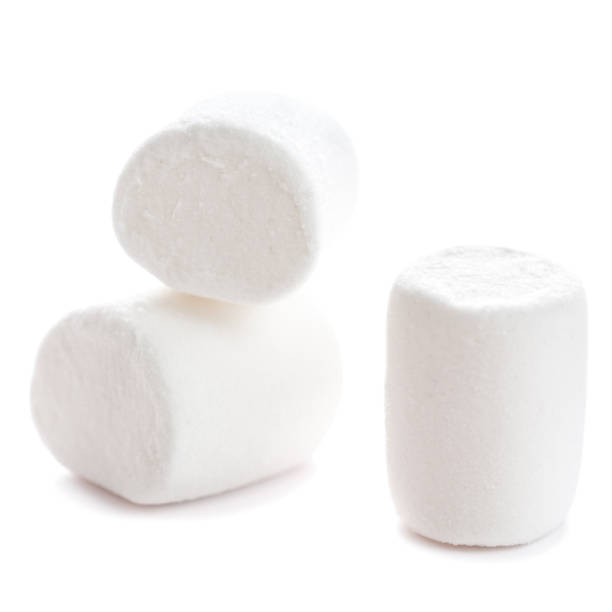 istock Fluffy white marshmallow macro isolated over white background. Heap of white marshmallows