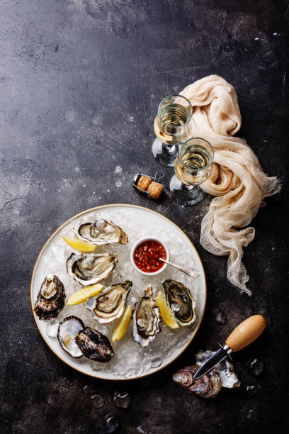 Open Oysters with spicy sauce and champagne