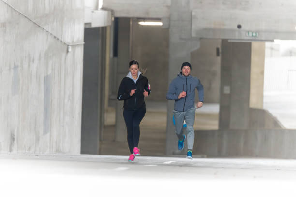 istock Young couple running together 642231880