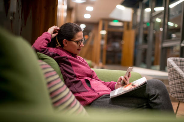 istock Woman reading magazine 642231928