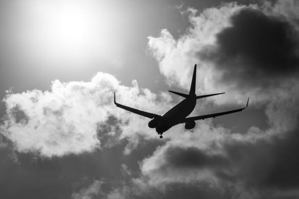 istock Commercial Airplane Flying On Moody Sky With Clouds 642232018