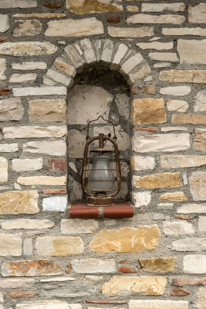 istock Stone wall and old oil lamp 642235966